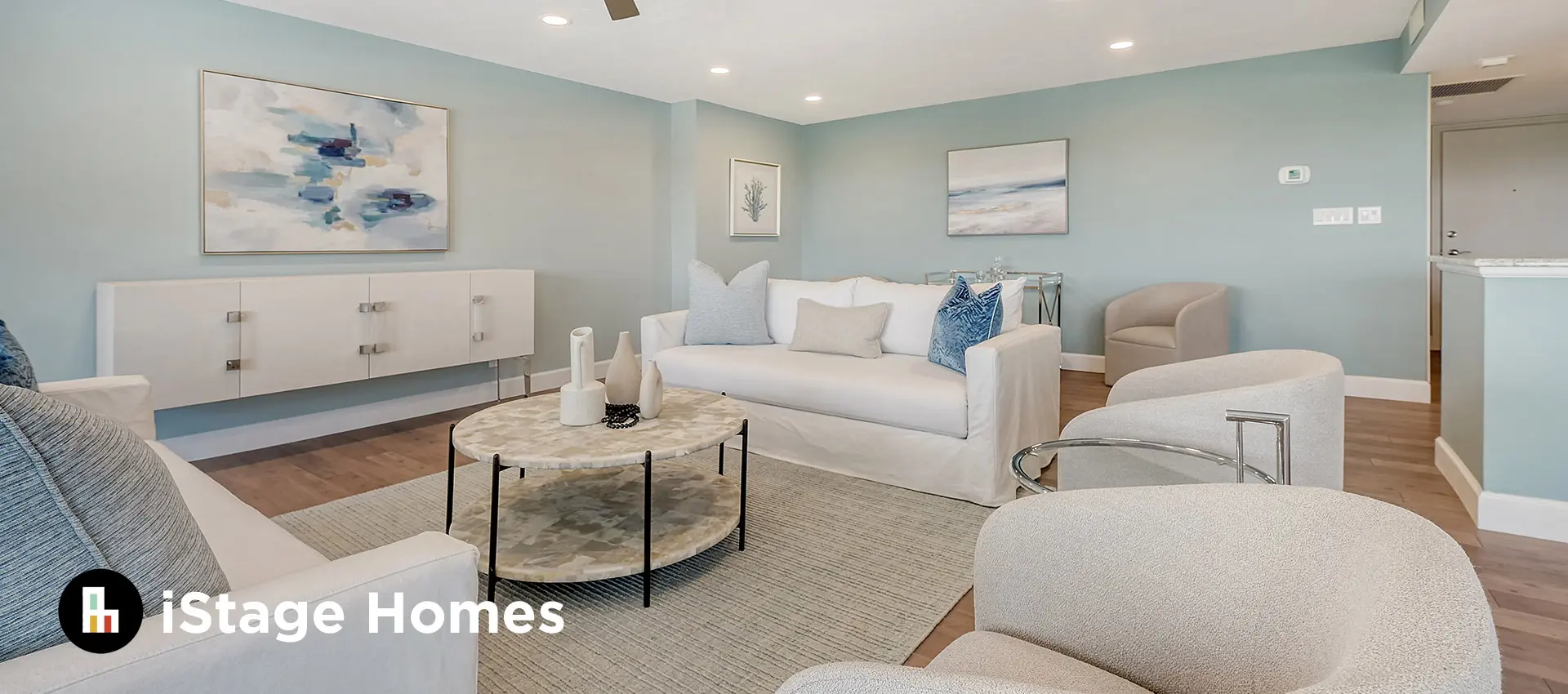 Coastal living room staging with blue accents