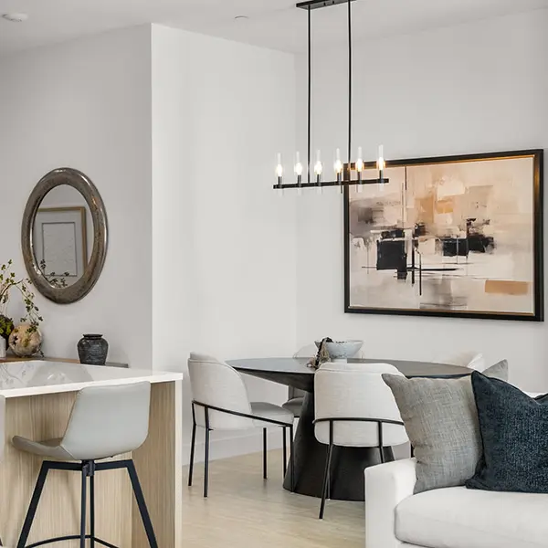 Contemporary condo staging in Downtown Sarasota featuring modern dining area with neutral tones and clean lines