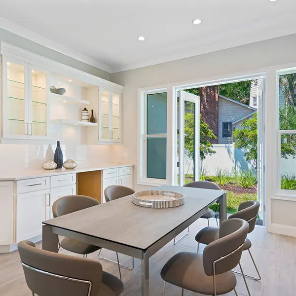 Coastal spec home staging in McClellan Park Sarasota featuring modern dining area with natural light and clean design