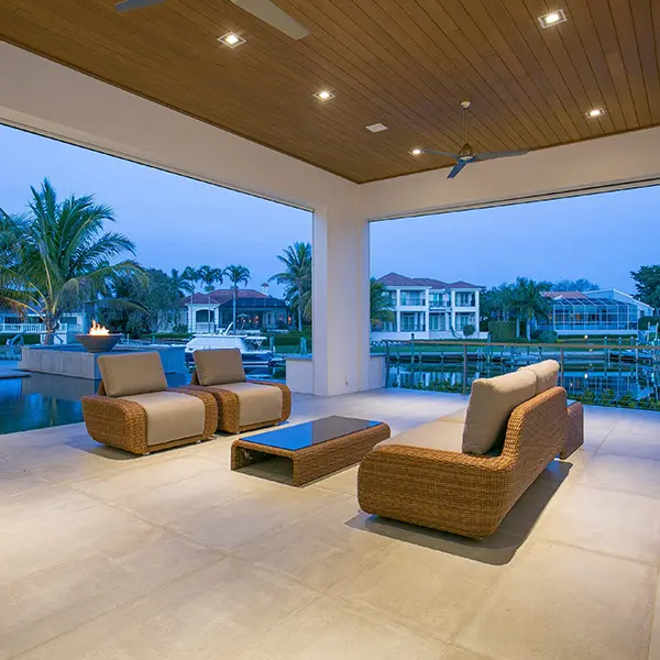 Contemporary home staging in Bay Isles Longboat Key featuring covered outdoor living space with waterfront views