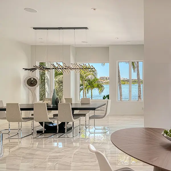 Contemporary home staging in Lido Shores Sarasota featuring modern dining area with waterfront views and clean design