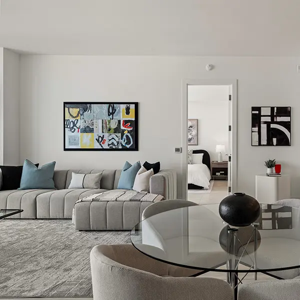 Luxury condo staging in Sarasota featuring modern living room with neutral tones and open layout