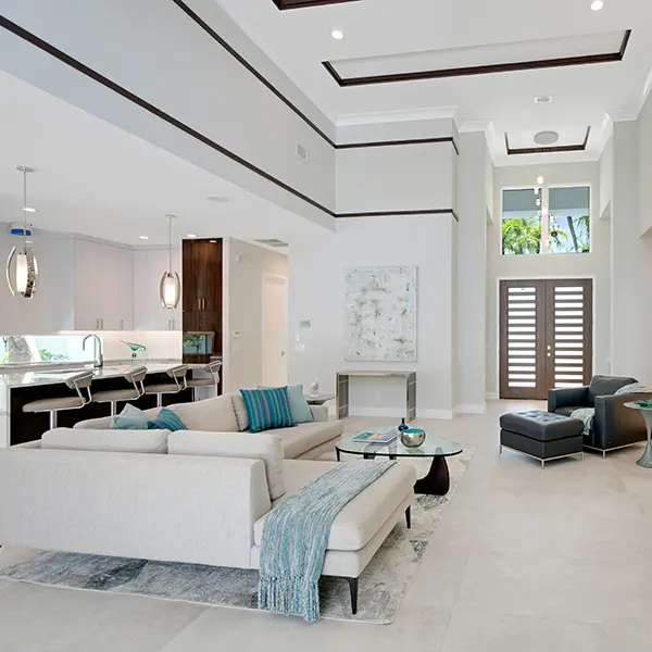 Modern spec home staging in McClellan Park Sarasota featuring open living room with high ceilings and contemporary design