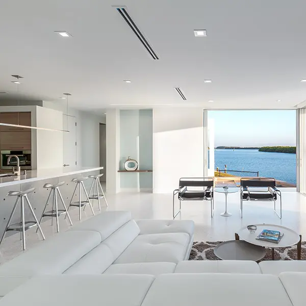 Modern waterfront home staging in Longboat Key featuring open living space with minimalist design and panoramic water views