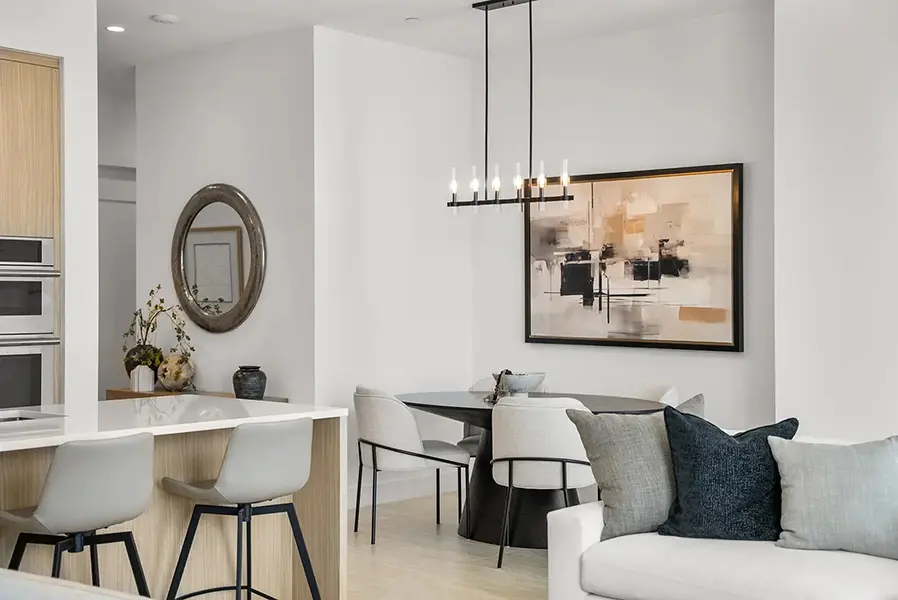 Contemporary condo staging in Downtown Sarasota featuring modern dining area with neutral tones and clean lines