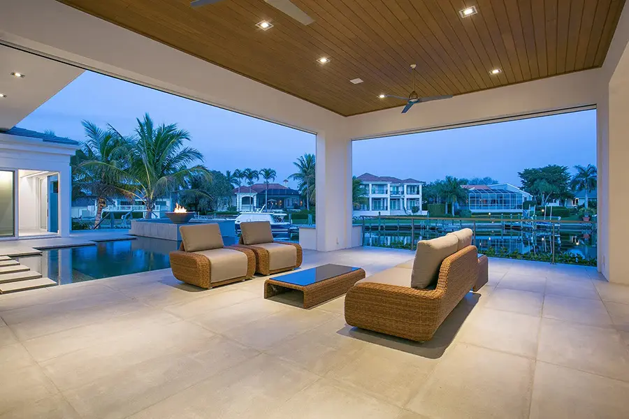 Contemporary home staging in Bay Isles Longboat Key featuring covered outdoor living space with waterfront views