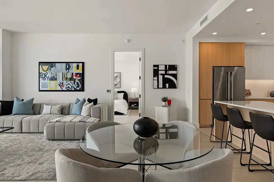 Luxury condo staging in Sarasota featuring modern living room with neutral tones and open layout