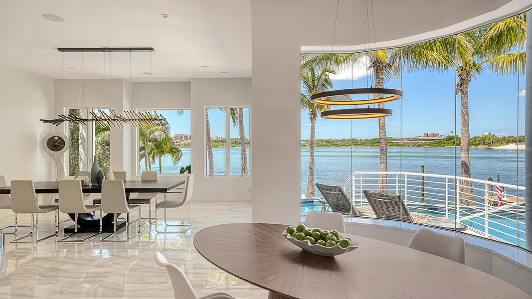 Contemporary home staging in Lido Shores Sarasota featuring modern dining area with waterfront views and clean design