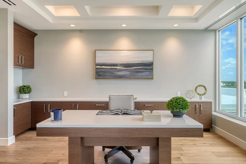 Contemporary home office with modern desk and wood cabinetry