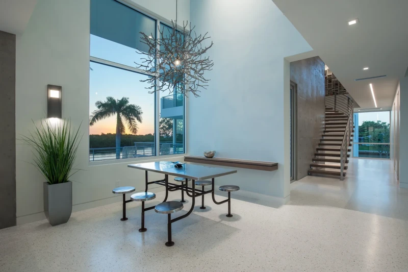 Modern dining room staging with contemporary lighting