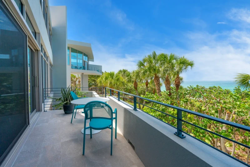 Contemporary coastal balcony staging with Gulf views on Casey Key in Sarasota