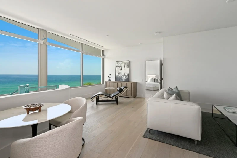Contemporary primary suite lounge staging with Gulf views on Casey Key
