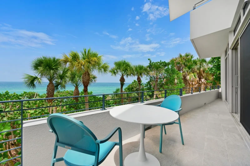 Private Gulf-facing balcony seating area at Casey Key waterfront residence