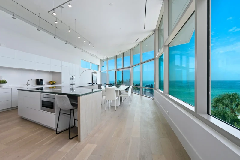 Contemporary waterfront kitchen and dining area staging on Casey Key Sarasota