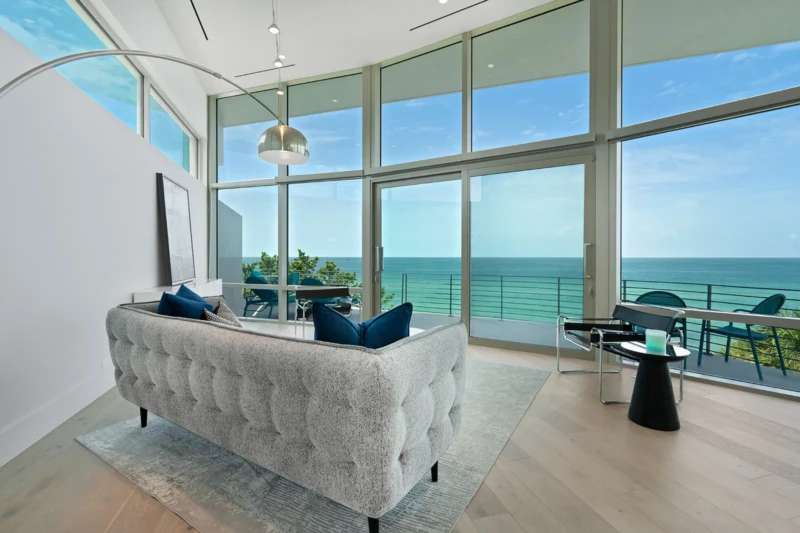 Contemporary waterfront living room staging with Gulf views on Casey Key Sarasota