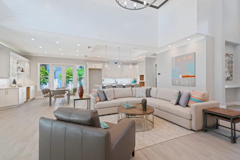 Coastal contemporary home staging with open-concept living room and kitchen in Sarasota home