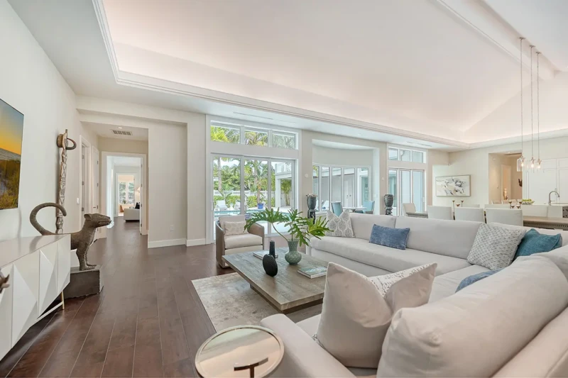 Coastal luxury living room staging with open layout and contemporary furnishings