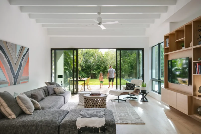 Contemporary home staging in Sarasota with indoor-outdoor living, vaulted ceilings, custom wood built-ins, and modern luxury furnishings