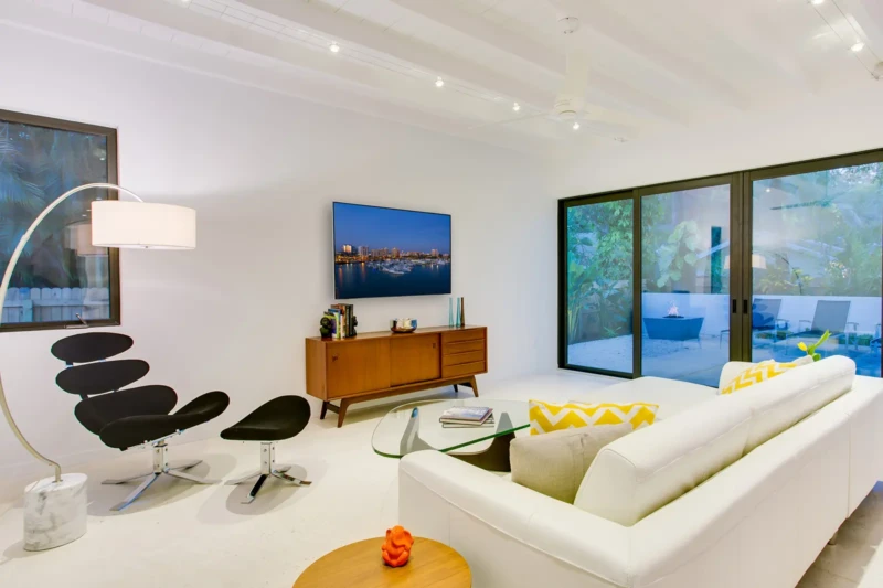 Contemporary living area staging with indoor-outdoor design in Sarasota
