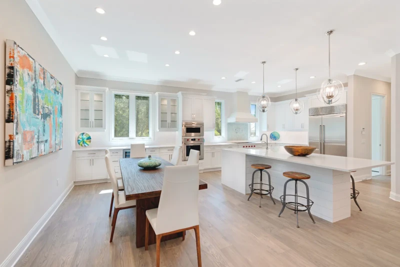 Contemporary kitchen and dining room staging in Paradise Shores West of Trail Sarasota spec home