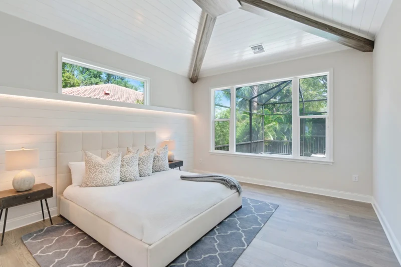 Primary bedroom staging in contemporary Paradise Shores West of Trail Sarasota spec home