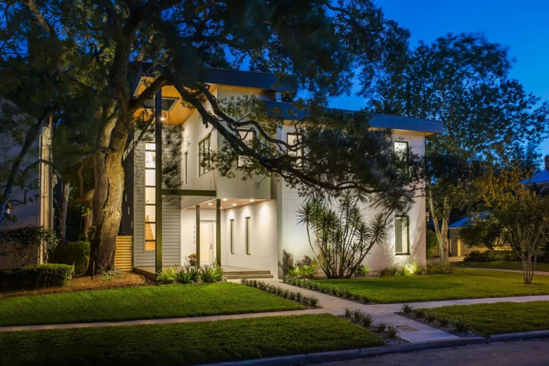 Contemporary spec home staging exterior overlooking Tampa Bay at dusk