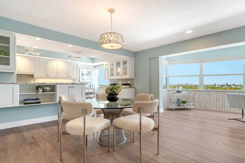 Coastal contemporary dining room staging in a Lido Key condo