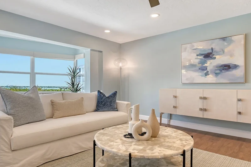 Coastal contemporary living room staging in a Lido Key condo