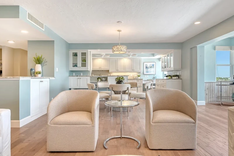 Coastal contemporary condo staging with open-concept kitchen and dining area on Lido Key