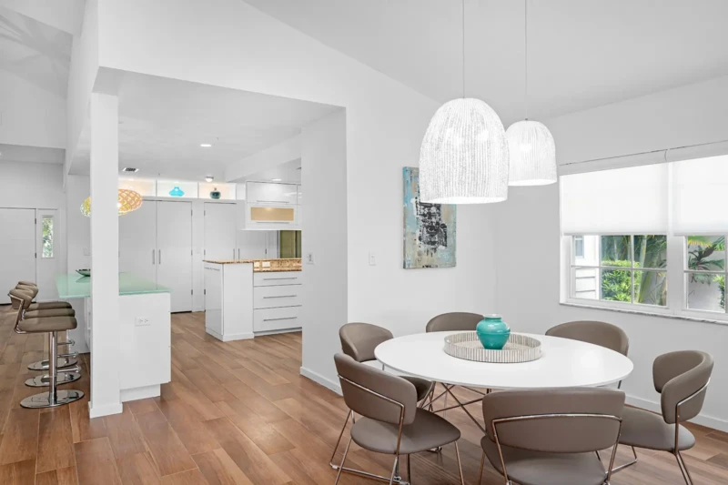 Modern coastal dining area staging in Bay Isles condo on Longboat Key
