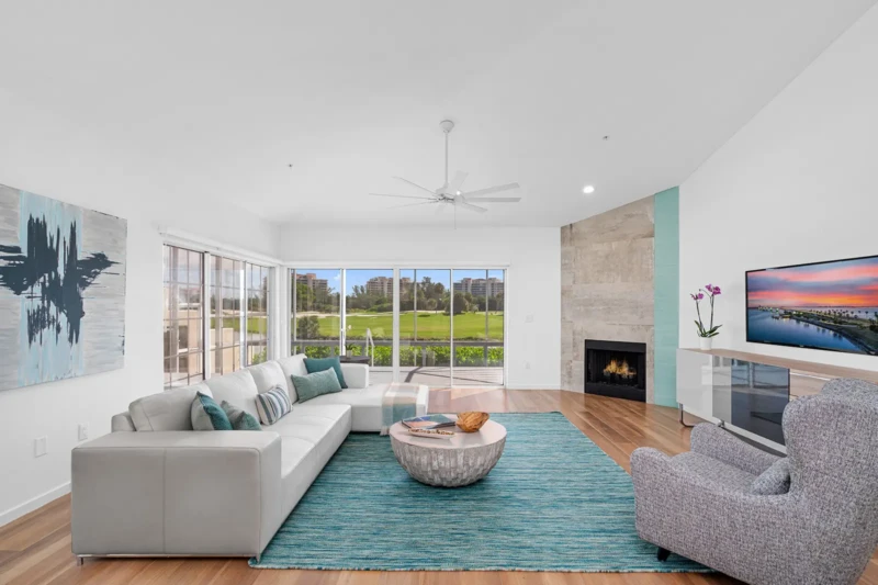 Coastal contemporary condo living room staging overlooking Bay Isles golf course on Longboat Key