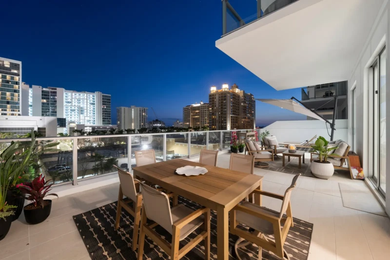 Luxury condo balcony with downtown Sarasota night views at Bayso