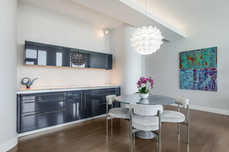 Luxury condo dining area staging at The Jewel Sarasota with modern lighting and contemporary furnishings