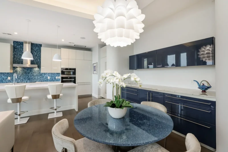 Luxury condo dining area and contemporary kitchen staging at The Jewel Sarasota condominium