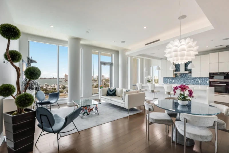 Luxury condo living room and kitchen staging at The Jewel Sarasota with bay views and contemporary furnishings