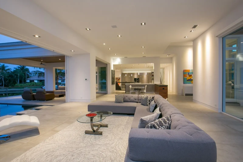 Luxury modern living room staging with indoor-outdoor design in Bay Isles South waterfront home on Longboat Key