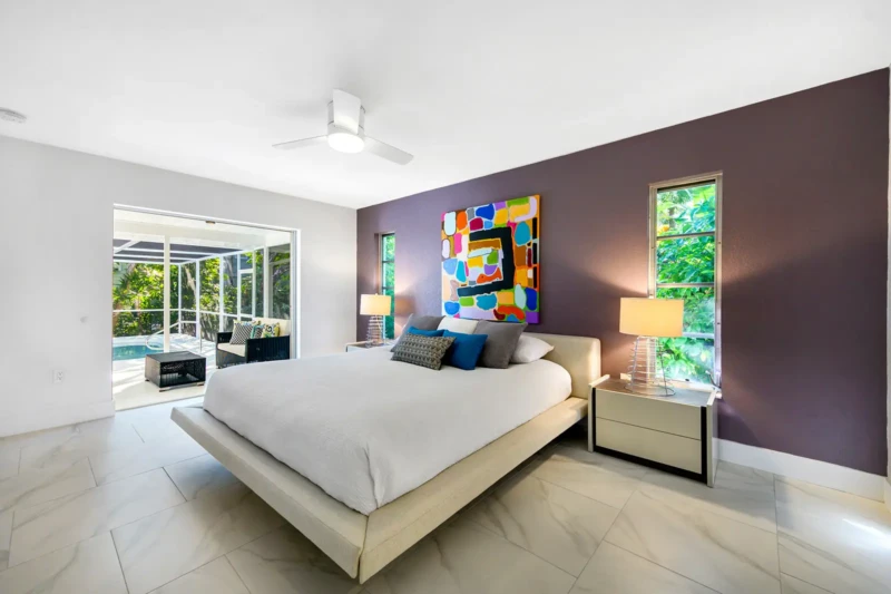 Modern bedroom staging in a mid-century Siesta Key home