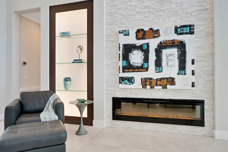 Modern fireplace feature wall and living room staging in Sarasota luxury spec home