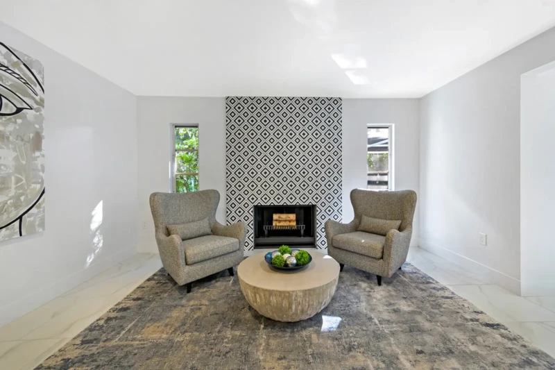 Modern sitting area staging with geometric fireplace design in a Siesta Key home