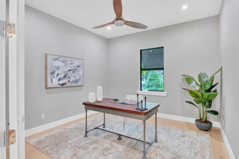 Modern home office staging in East of the Trail Sarasota home featuring minimalist workspace design, soft neutral interiors, and contemporary luxury home accents