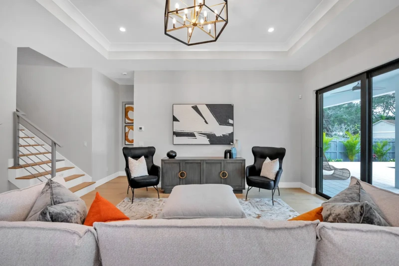 Modern living room staging in East of the Trail Sarasota home with contemporary furnishings, open layout, luxury finishes, and indoor-outdoor living design