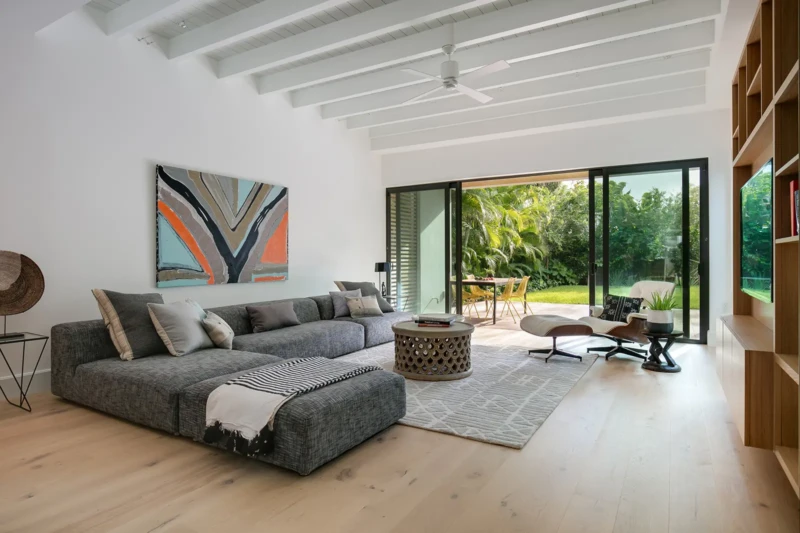Modern luxury home staging in Sarasota featuring vaulted ceilings, open-concept living room, and indoor-outdoor contemporary design