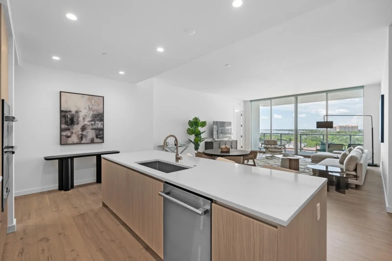 Modern open-concept condo staging with kitchen island and contemporary living area