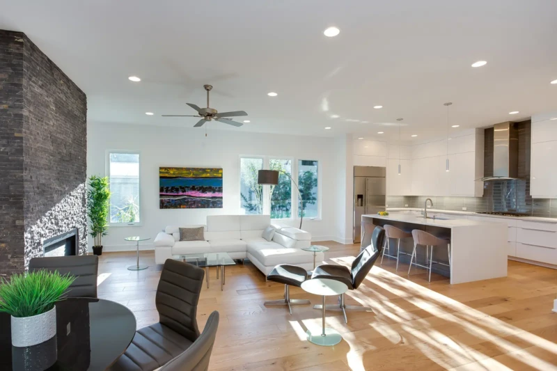 Modern open-concept luxury home staging with contemporary kitchen and living room design