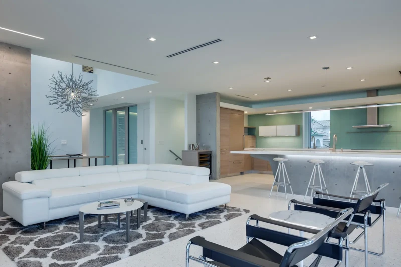 Modern open-concept luxury interior with minimalist furnishings and designer kitchen on Longboat Key
