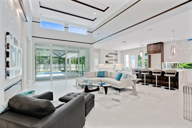 Modern open concept living room and kitchen staging in Sarasota luxury spec home