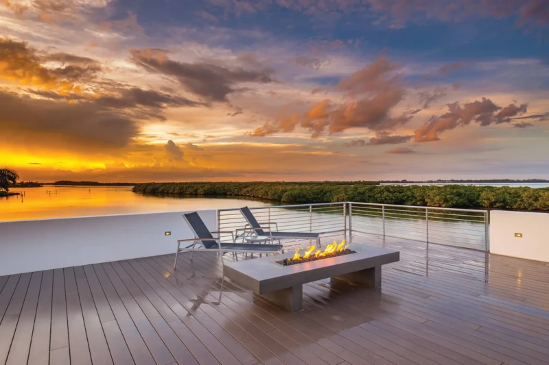 Rooftop terrace with fire pit and panoramic waterfront sunset views in Longboat Key luxury home
