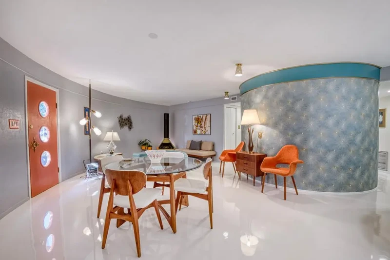Curved mid-century modern dining room staging inside Sarasota Round House