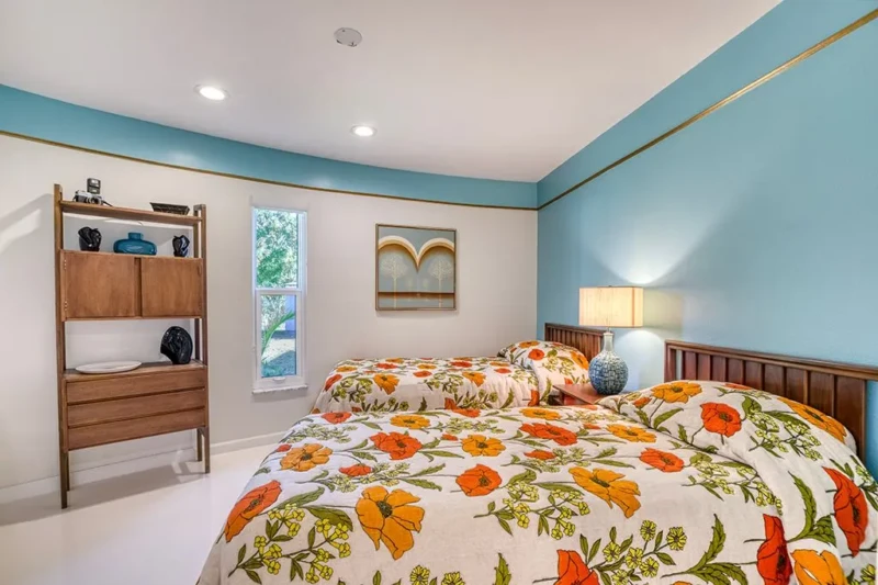 Colorful mid-century modern guest bedroom staging in Sarasota Round House