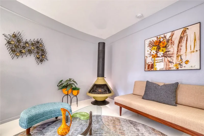 Retro lounge area with vintage fireplace in Sarasota Round House